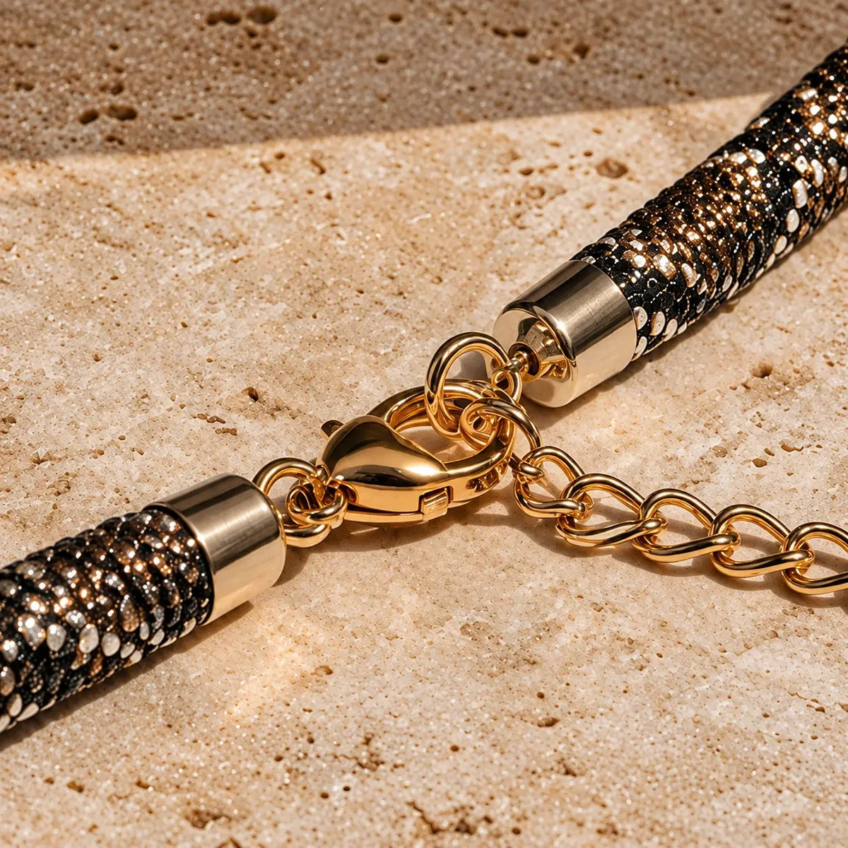 Gold-tone clasp and extension chain close-up